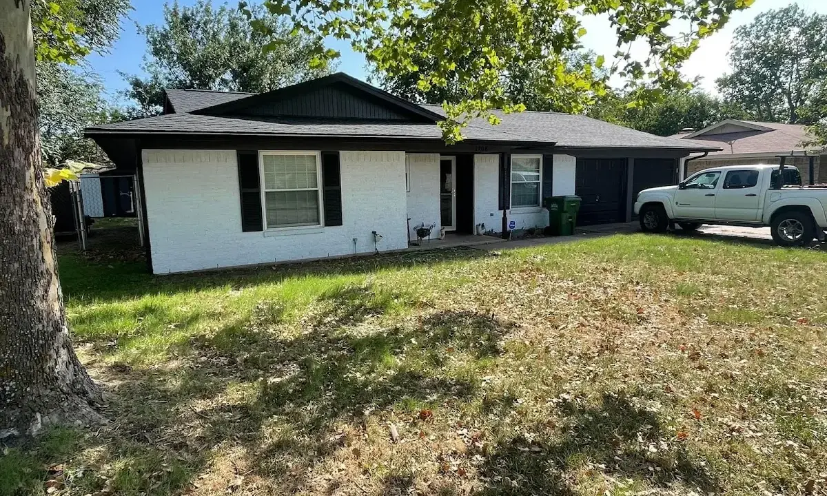 Professional roofing crew working on a residential roof in South Hill